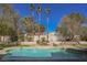 Inviting pool and spa area with lush landscaping, ideal for relaxation and outdoor entertaining at 2805 High Sail Ct, Las Vegas, NV 89117