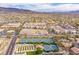 Beautiful aerial view showcasing tennis courts, new construction, and surrounding houses at 2864 Sumter Valley Cir, Henderson, NV 89052