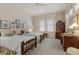 Cozy bedroom with two twin beds, floral accents, and decorative wall art at 2864 Sumter Valley Cir, Henderson, NV 89052