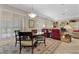 Open dining area with table, chairs, shutters, and view of living space at 2864 Sumter Valley Cir, Henderson, NV 89052