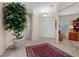 Spacious foyer with tiled floors, a large decorative rug, and views into other rooms at 2864 Sumter Valley Cir, Henderson, NV 89052