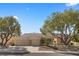 Beautiful single-story home features a three-car garage and mature shade trees in landscaped front yard at 2864 Sumter Valley Cir, Henderson, NV 89052
