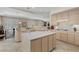 Bright kitchen featuring an island, tile floors, recessed lighting, and plenty of cabinet space at 2864 Sumter Valley Cir, Henderson, NV 89052