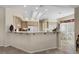 Bright kitchen with wooden cabinetry, breakfast bar, and modern appliances at 2864 Sumter Valley Cir, Henderson, NV 89052