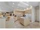 Open kitchen features neutral cabinets, an island, and modern appliances in a well-lit room at 2864 Sumter Valley Cir, Henderson, NV 89052
