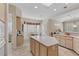 Bright open kitchen with an island, modern cabinets and a breakfast nook with bay windows at 2864 Sumter Valley Cir, Henderson, NV 89052