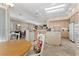 Large, open kitchen with an island, tile floors, and a breakfast nook with bright windows at 2864 Sumter Valley Cir, Henderson, NV 89052