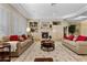 Spacious living room with two sofas, decorative rug, fireplace, and built-in shelves at 2864 Sumter Valley Cir, Henderson, NV 89052