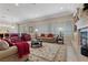 Bright living room featuring comfortable seating, fireplace, recessed lighting, and shuttered windows at 2864 Sumter Valley Cir, Henderson, NV 89052