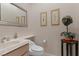 Charming powder room featuring elegant fixtures, decorative accents, and a stylish vanity at 2864 Sumter Valley Cir, Henderson, NV 89052