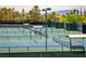 Multiple well-maintained tennis courts with lights for evening play at 2864 Sumter Valley Cir, Henderson, NV 89052