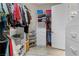 Walk-in closet features custom shelving, drawers, and ample storage for clothing and accessories at 2864 Sumter Valley Cir, Henderson, NV 89052