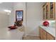 Stylish wet bar area featuring custom cabinets, a wine rack, and a sink at 2864 Sumter Valley Cir, Henderson, NV 89052