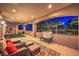 Expansive covered balcony with outdoor seating and views of the landscaping at 3051 Traverse Creek Ln, Las Vegas, NV 89135