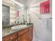 Bathroom featuring granite countertops, custom cabinets, and modern fixtures at 3051 Traverse Creek Ln, Las Vegas, NV 89135