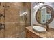Bathroom with a walk-in shower, vanity, and decorative lighting at 3051 Traverse Creek Ln, Las Vegas, NV 89135