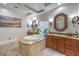 Bathroom featuring a soaking tub, dual sinks with granite countertops, and natural lighting at 3051 Traverse Creek Ln, Las Vegas, NV 89135
