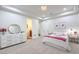 Bright bedroom with modern chandelier, pink accents, and ensuite bathroom access at 3051 Traverse Creek Ln, Las Vegas, NV 89135