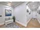 Bright hallway featuring neutral paint, high ceilings, and decorative art at 3051 Traverse Creek Ln, Las Vegas, NV 89135