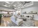 Spacious living area with plush seating and open flow to the gourmet kitchen at 3051 Traverse Creek Ln, Las Vegas, NV 89135