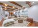 Cozy living room with a large sectional sofa and beautiful area rug at 3051 Traverse Creek Ln, Las Vegas, NV 89135