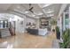 Expansive living room with coffered ceilings, fireplace feature wall, and staircase at 3051 Traverse Creek Ln, Las Vegas, NV 89135
