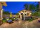 Outdoor kitchen featuring a built-in grill and bar area, perfect for outdoor cooking and dining at 3051 Traverse Creek Ln, Las Vegas, NV 89135