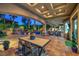Covered patio with elegant ceiling details and outdoor dining area, ideal for entertaining at 3051 Traverse Creek Ln, Las Vegas, NV 89135