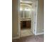 Bathroom with tiled floors, vanity, and an arched doorway at 32 Via Vasari # 103, Henderson, NV 89011