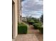 Lush landscaping and plants surround a beautifully paved walkway at 32 Via Vasari # 103, Henderson, NV 89011