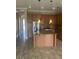 Spacious kitchen featuring stainless steel appliances, a center island, and ample cabinetry at 32 Via Vasari # 103, Henderson, NV 89011