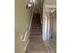 Carpeted staircase leading to the upper level at 32 Via Vasari # 103, Henderson, NV 89011