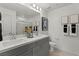 Elegant bathroom featuring double sinks, sleek countertops, and a large mirror at 321 Cymbal Pl # Lot 130, Henderson, NV 89015