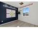 Well-lit bonus room with laminated floors, marketing signage, and a view of the outdoors at 321 Cymbal Pl # Lot 130, Henderson, NV 89015