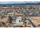 Panoramic aerial view of a residential neighborhood with single-Gathering homes, desert landscaping, and surrounding mountains at 3290 Vicki Ave, Las Vegas, NV 89139