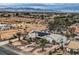 Wide aerial view of a desert neighborhood with a home that has solar panels and desert landscaping at 3290 Vicki Ave, Las Vegas, NV 89139