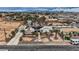 Aerial view of a home with solar panels, a long driveway, desert landscaping, and a spacious backyard at 3290 Vicki Ave, Las Vegas, NV 89139