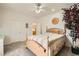 Cozy bedroom with neutral colored walls and carpet, featuring a wooden bed frame and decorative accents at 3290 Vicki Ave, Las Vegas, NV 89139