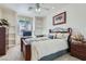 Well-lit bedroom features a cozy bed, built-in shelves, and a warm, inviting atmosphere at 3290 Vicki Ave, Las Vegas, NV 89139