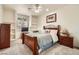 Comfortable bedroom boasts a cozy bed, built-in shelving, and abundant natural light at 3290 Vicki Ave, Las Vegas, NV 89139