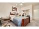 Comfortable bedroom boasts a cozy bed, mirrored closet, and abundant natural light at 3290 Vicki Ave, Las Vegas, NV 89139