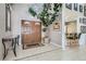 Elegant foyer with tile floors, a decorative plant, and views to a kitchen bar seating area at 3290 Vicki Ave, Las Vegas, NV 89139