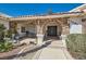 Inviting home exterior featuring a stone archway entrance and well-manicured landscaping at 3290 Vicki Ave, Las Vegas, NV 89139