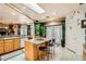 Bright kitchen features granite counters, tiled floors, and a convenient island with seating at 3290 Vicki Ave, Las Vegas, NV 89139