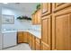 Laundry room with ample cabinet space, countertop, sink, and modern washer/dryer at 3290 Vicki Ave, Las Vegas, NV 89139