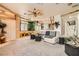 Cozy living room with a ceiling fan, carpet flooring, and a comfortable seating area at 3290 Vicki Ave, Las Vegas, NV 89139