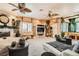 Spacious living room with plush carpeting, fireplace, and unique bamboo-themed decor at 3290 Vicki Ave, Las Vegas, NV 89139