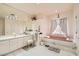 Bright main bathroom features a soaking tub, double vanity, and tile flooring at 3290 Vicki Ave, Las Vegas, NV 89139