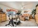 Spacious main bedroom featuring exercise equipment, a ceiling fan, and natural light at 3290 Vicki Ave, Las Vegas, NV 89139