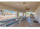 Covered patio with outdoor dining area, ceiling fans, and spacious seating for relaxing and entertaining at 3290 Vicki Ave, Las Vegas, NV 89139